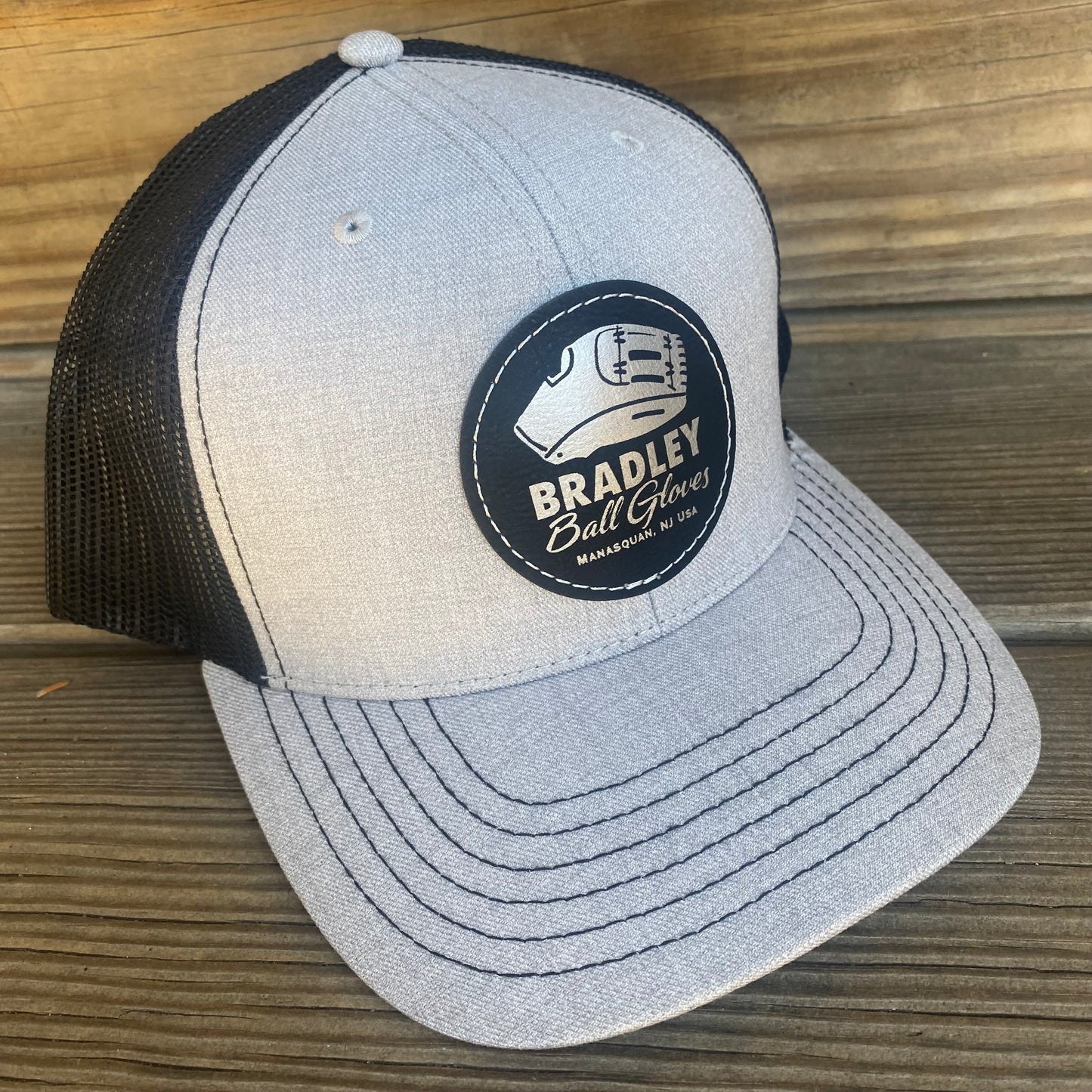 Bradley CGE 2025 V2 Leather Patch Trucker Hat Black/Heather Gray