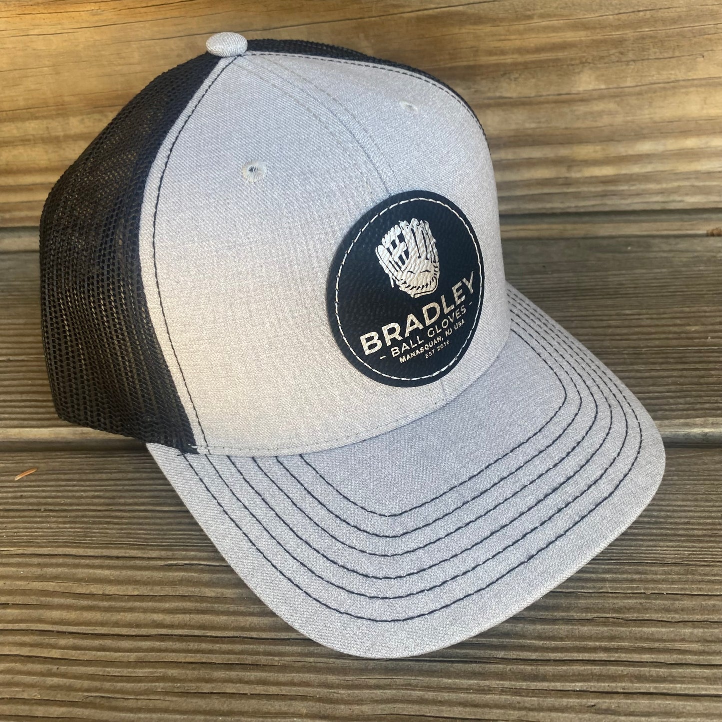 Bradley CGE 2025 Leather Patch Trucker Hat Black/Heather Gray